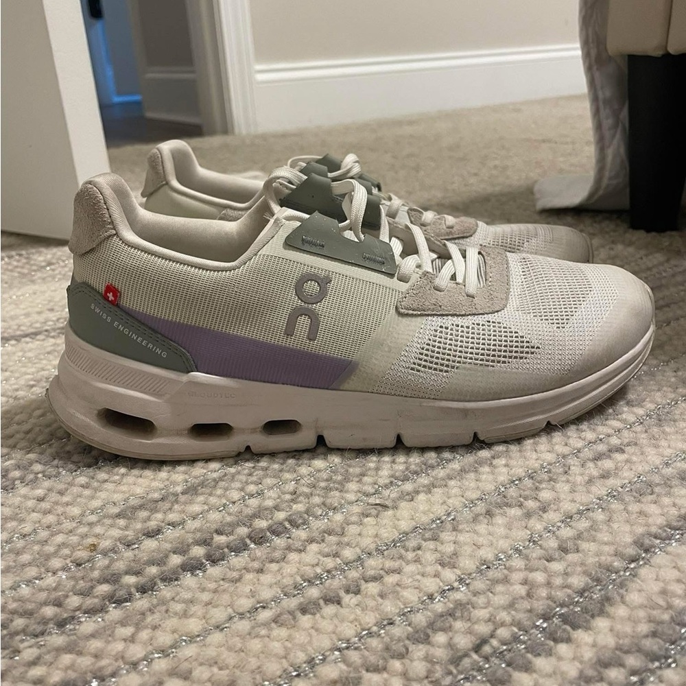 On Running White and Tan Sneakers with Purple Detail